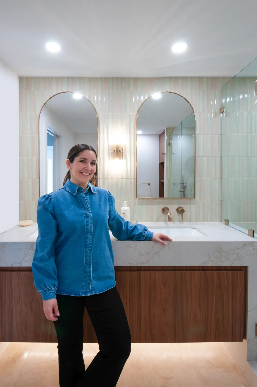 Camila in a finished primary bath with sage tile