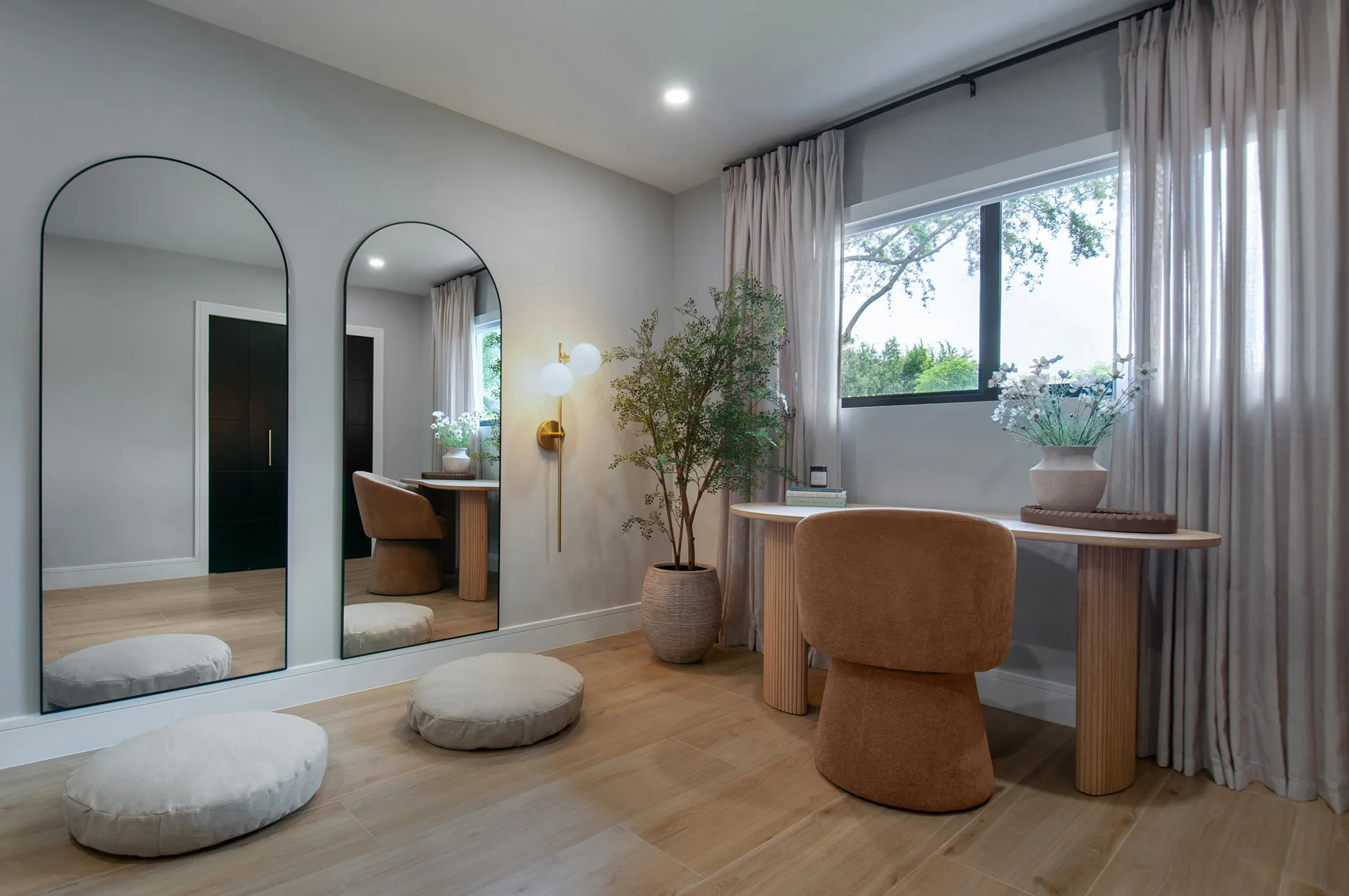 The zen room, with arched mirrors and floor cushions