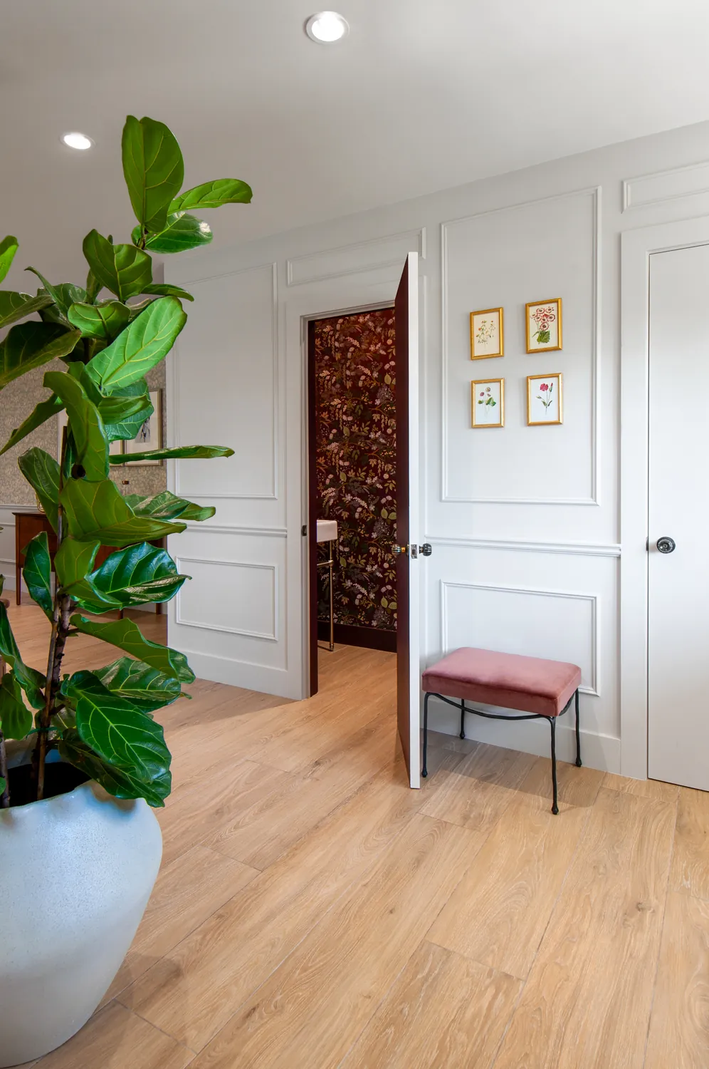 The hallway, powder room beyond