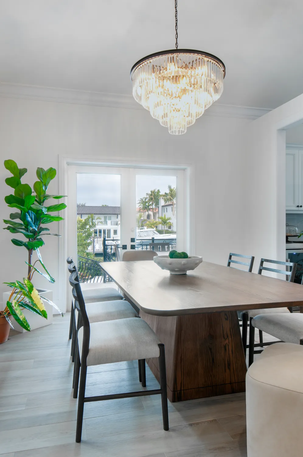 Custom dining table under the chandelier